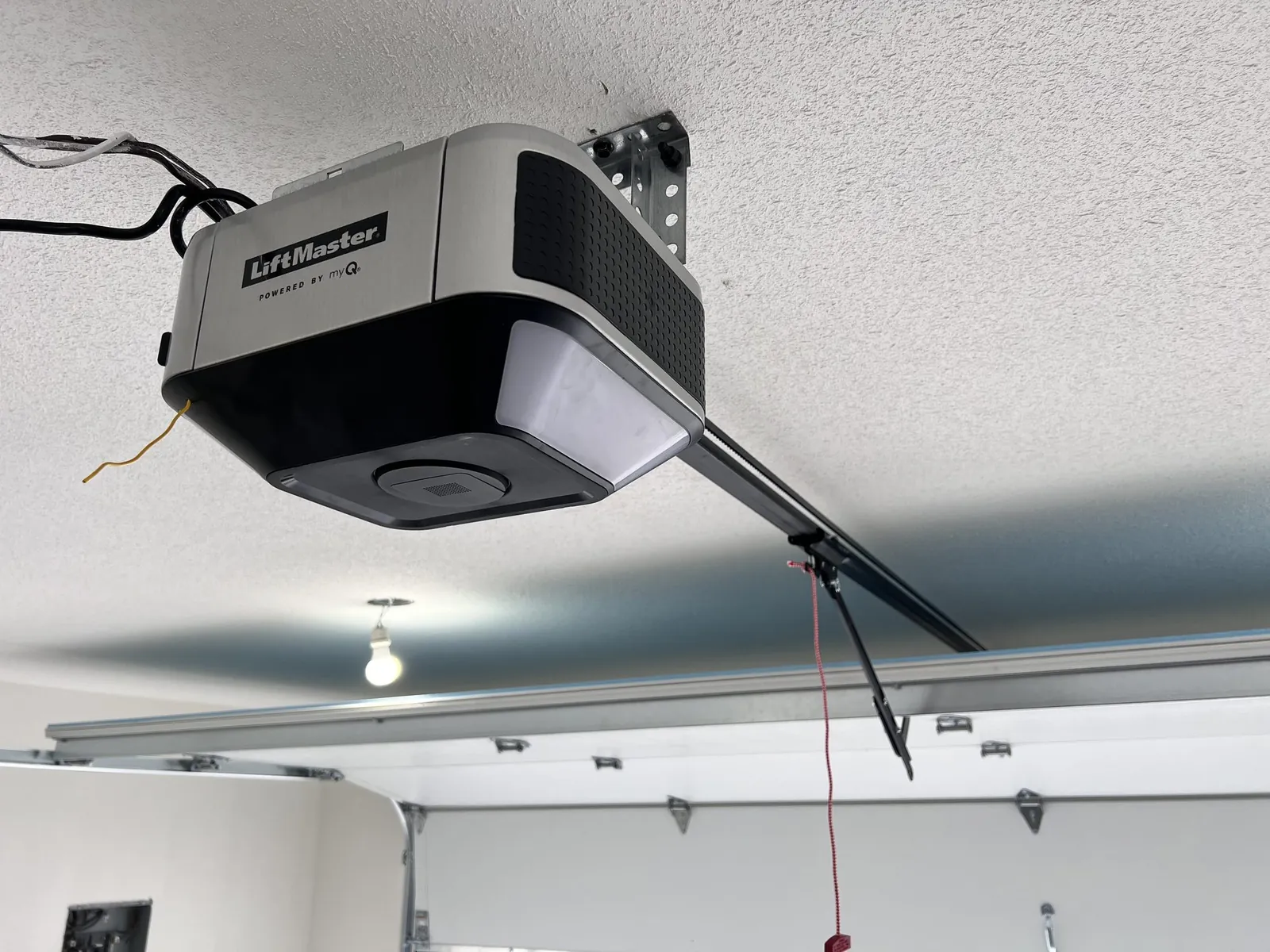 LiftMaster garage door opener mounted on a garage ceiling