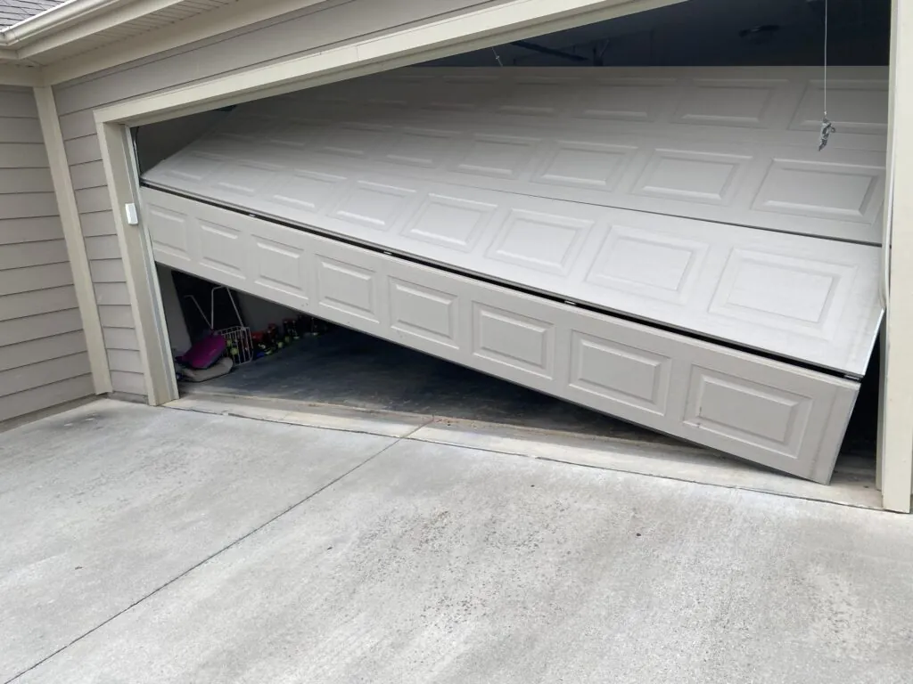 Garage door off its tracks and sagging in the opening — an emergency repair in Tsawwassen