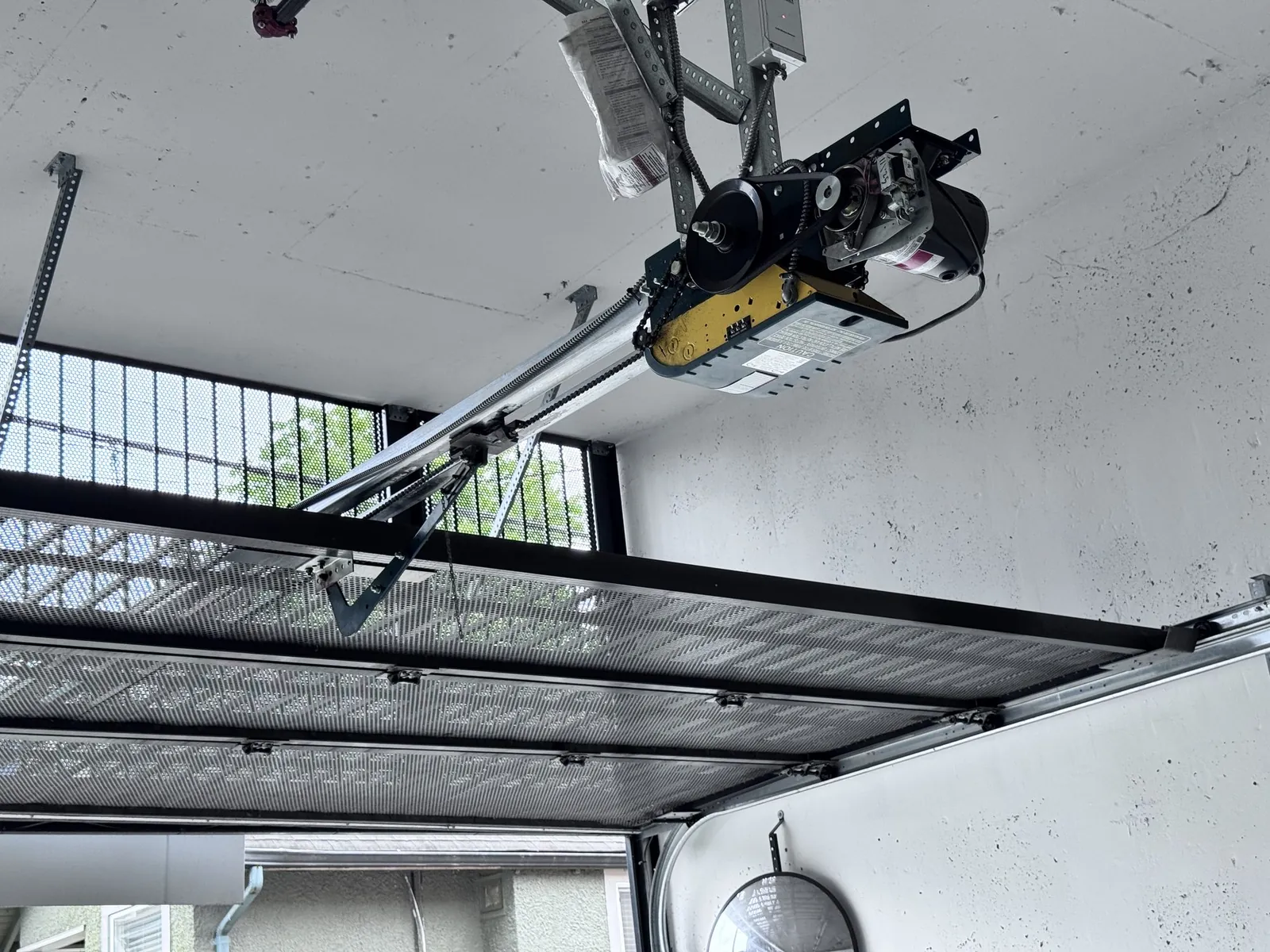 Garage door operator mounted on a parkade security gate at a Tsawwassen Town Centre strata building